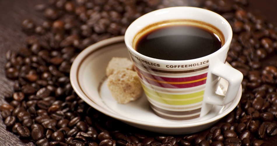 Coffee is a brewed beverage with a dark, acidic flavor prepared from the roasted seeds of...