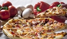 Pizza is an oven-baked, flat, disc-shaped bread typically topped with a tomato sauce, cheese and various toppings.