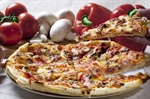 Pizza is an oven-baked, flat, disc-shaped bread typically topped with a tomato sauce, cheese and various toppings.