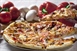 Pizza is an oven-baked, flat, disc-shaped bread typically topped with a tomato...