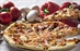 Pizza is an oven-baked, flat, disc-shaped bread typically topped...