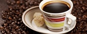 Coffee is a brewed beverage with a dark, acidic flavor prepared from the roasted seeds of the coffee...