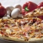 Pizza is an oven-baked, flat, disc-shaped bread typically topped with a tomato sauce,...